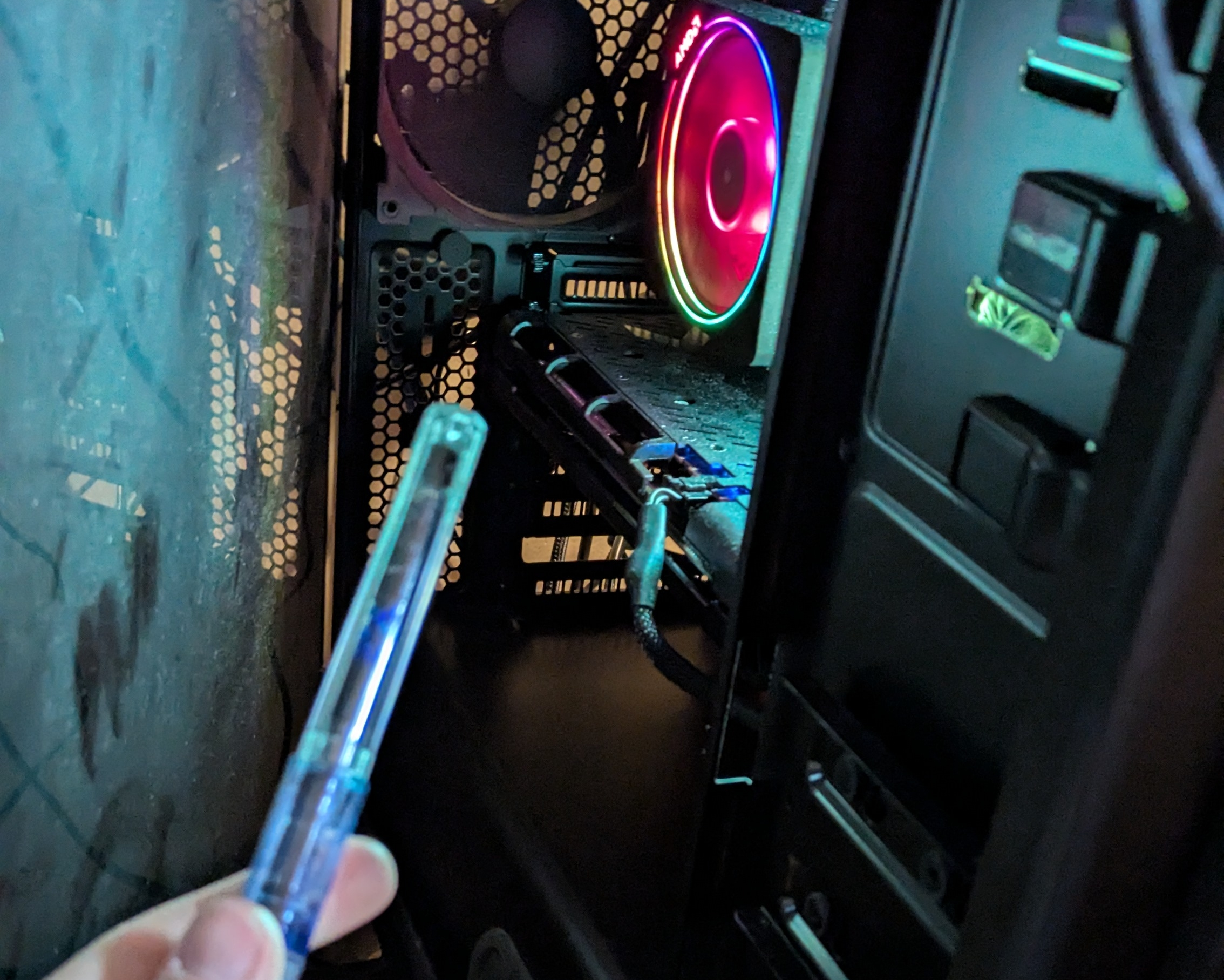 Me threatening a CPU fan with a fountain pen