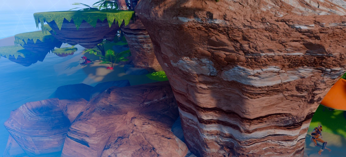 A picture in VRChat of the main meetup world, a rocky beachside area, where I am alone and hiding in the bottom